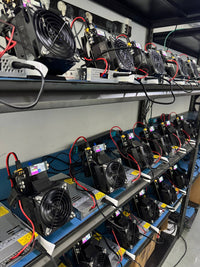 Production floor — every NerdQaxe++ paired with a Meanwell industrial PSU before ship
