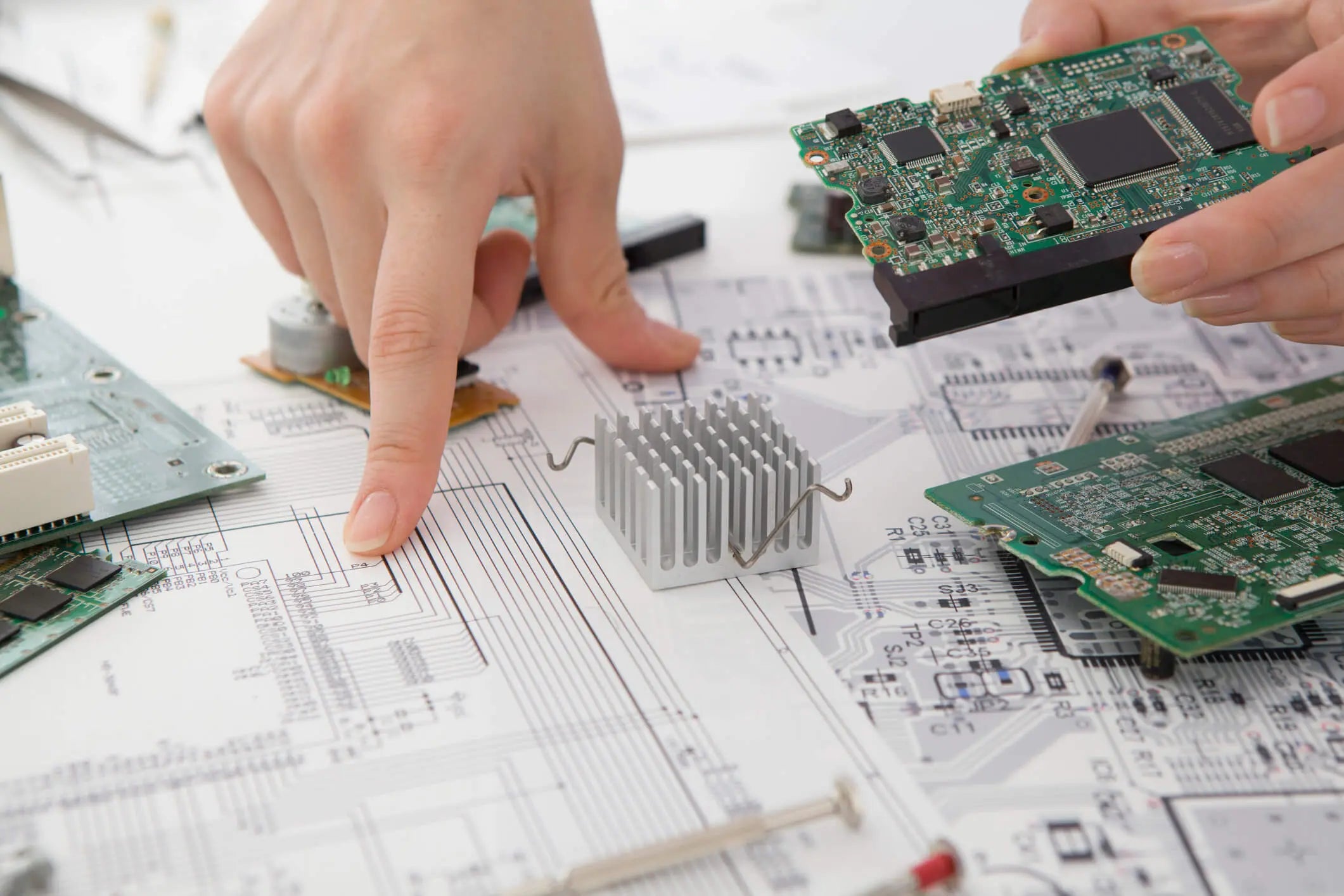Engineers reviewing board schematics